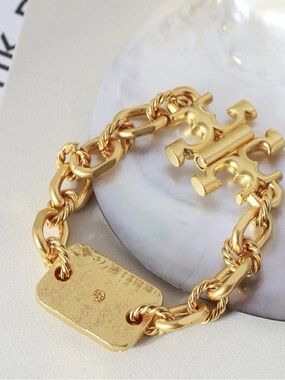 Tory Burch Authentic Torsade Vintage Gold Engraved Logo Bracelet